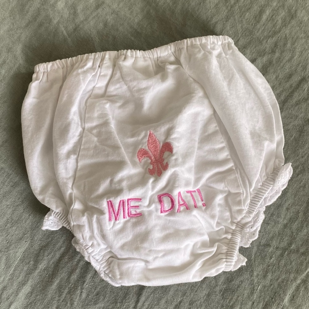 White and pink baby girl Saints-themed bloomers